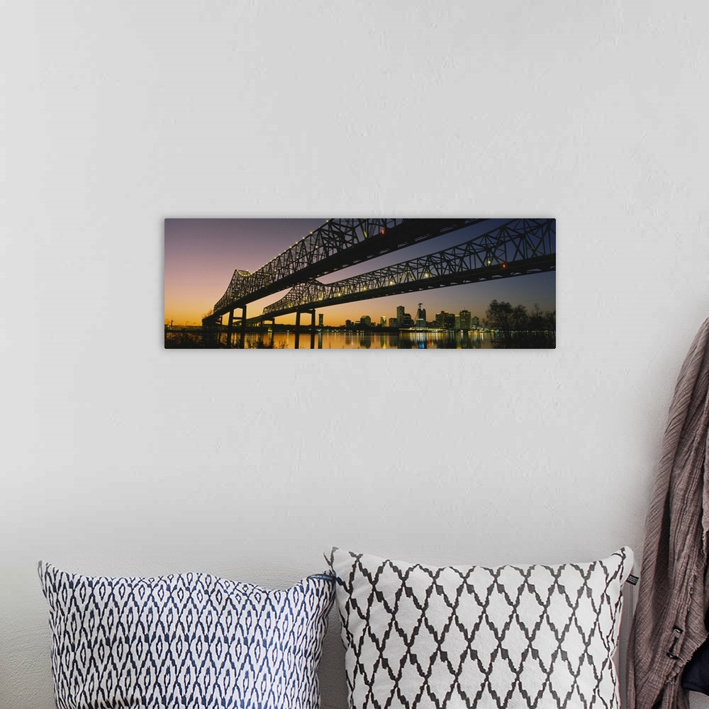 A bohemian room featuring Large panoramic photograph taken beneath a long bridge running across a river in New Orleans, Lou...