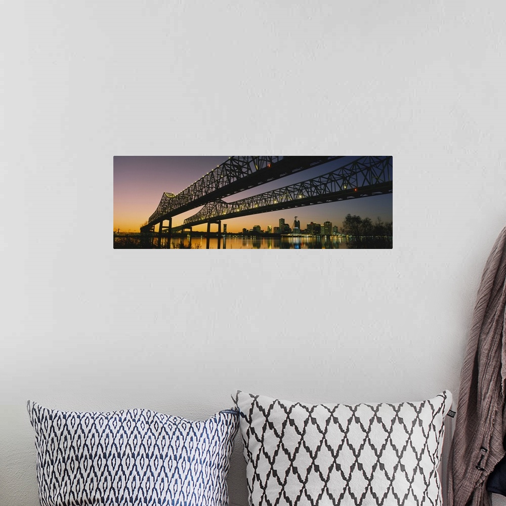 A bohemian room featuring Large panoramic photograph taken beneath a long bridge running across a river in New Orleans, Lou...