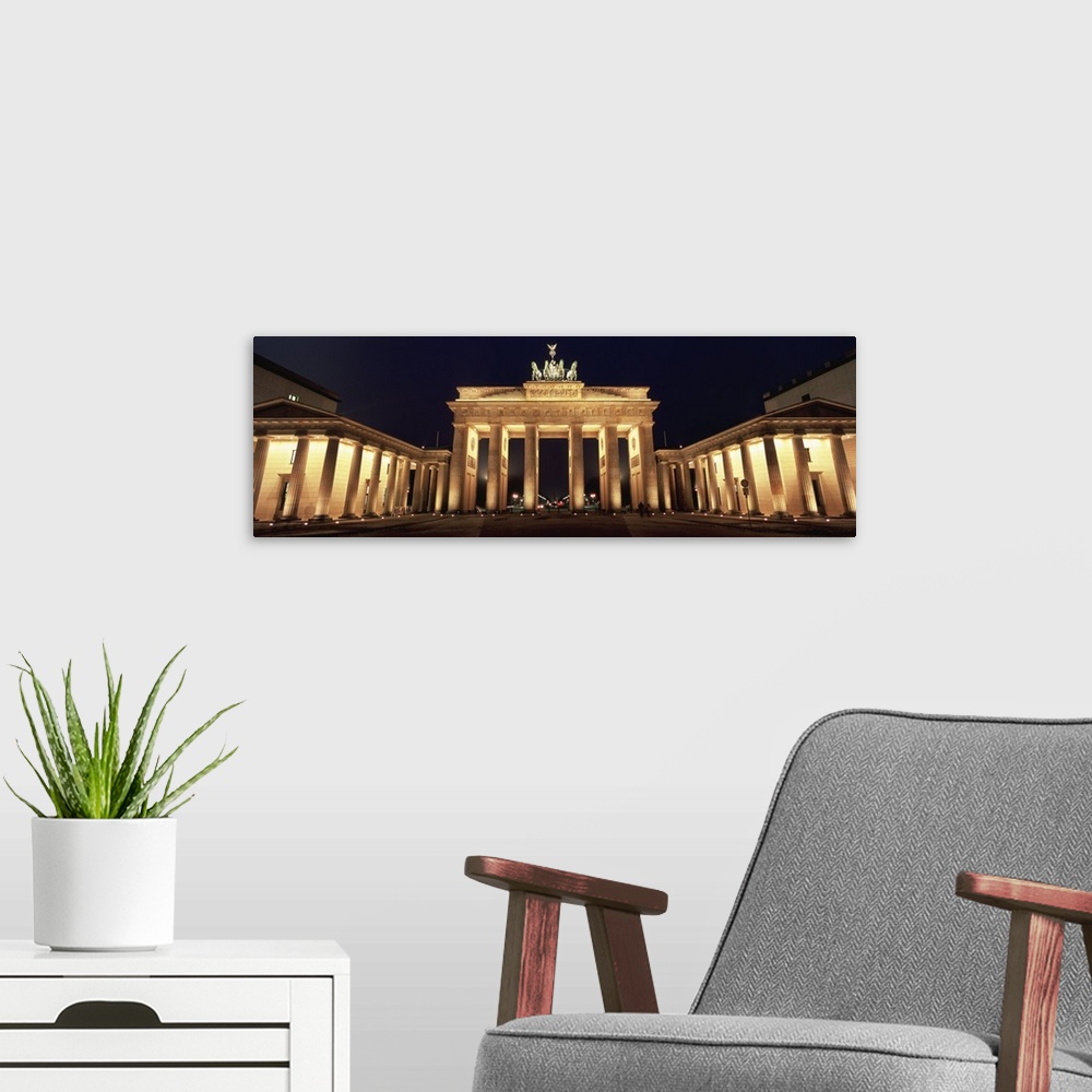 A modern room featuring Low angle view of a gate lit up at night, Brandenburg Gate, Berlin, Germany