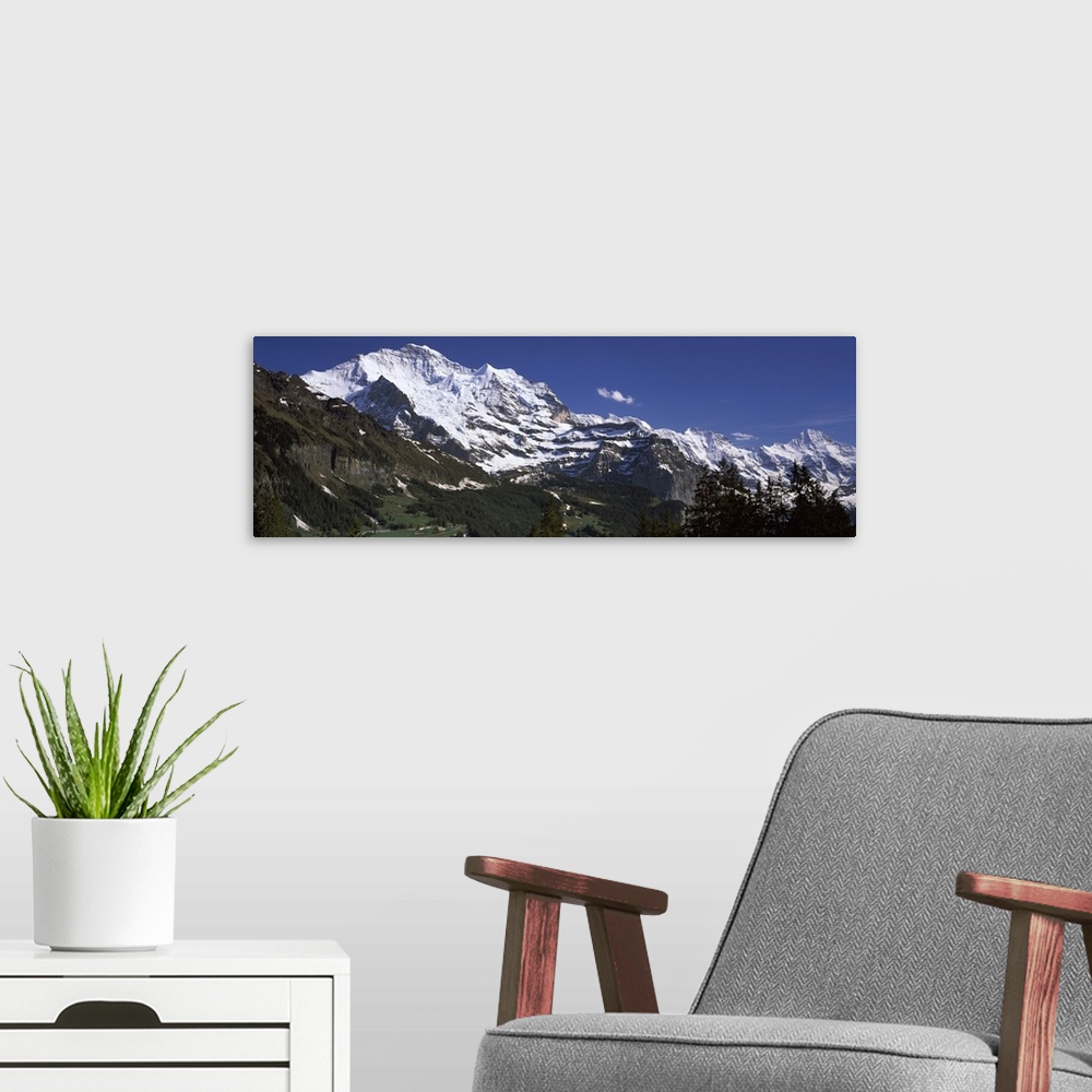 A modern room featuring Low angle view of a mountain range Mt Jungfrau Lauterbrunnen Valley Wengen Bernese Oberland Berne...