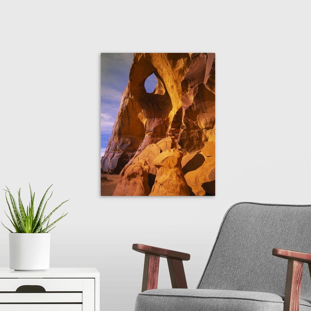 A modern room featuring Low angle view of a natural arch, Suns Eye Arch, Monument Valley Tribal Park, Arizona