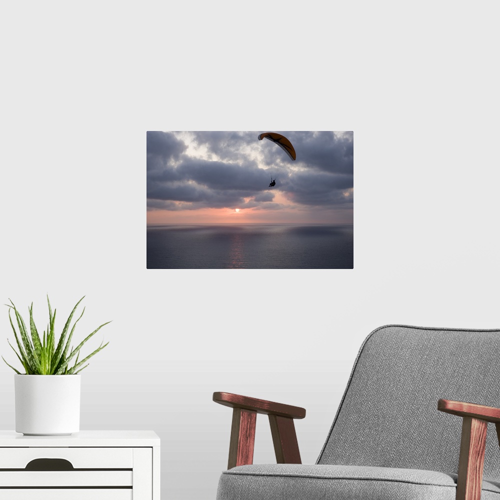A modern room featuring Low angle view of a paraglider flying in the sky over an ocean, Pacific Ocean, San Diego, California