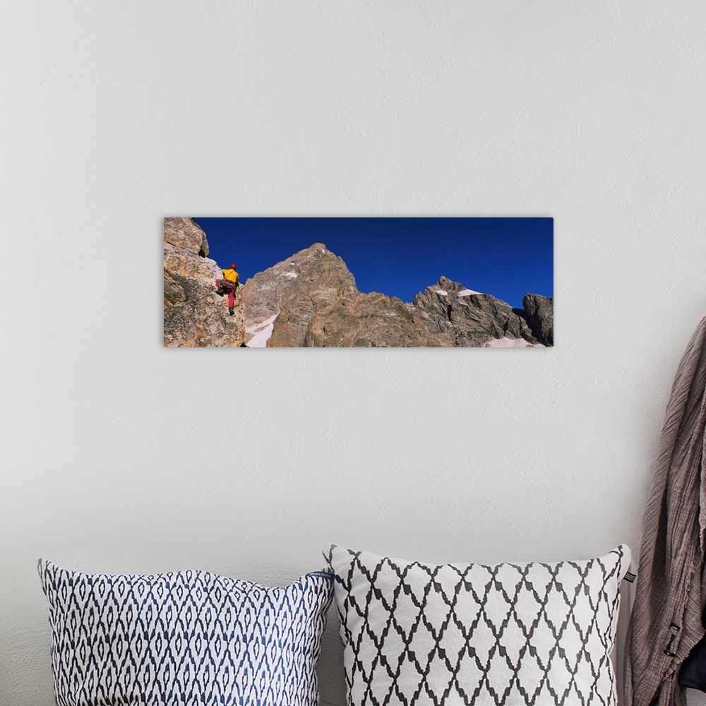 A bohemian room featuring Low angle view of a person rock climbing, Grand Teton National Park, Wyoming