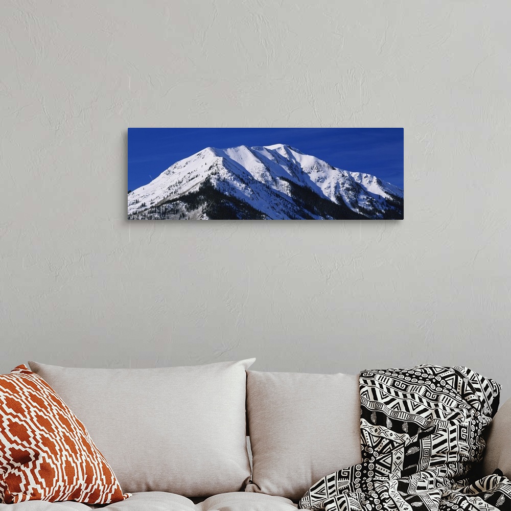 A bohemian room featuring Low angle view of a snow covered mountain, Rocky Mountains, Twin Lakes, Colorado
