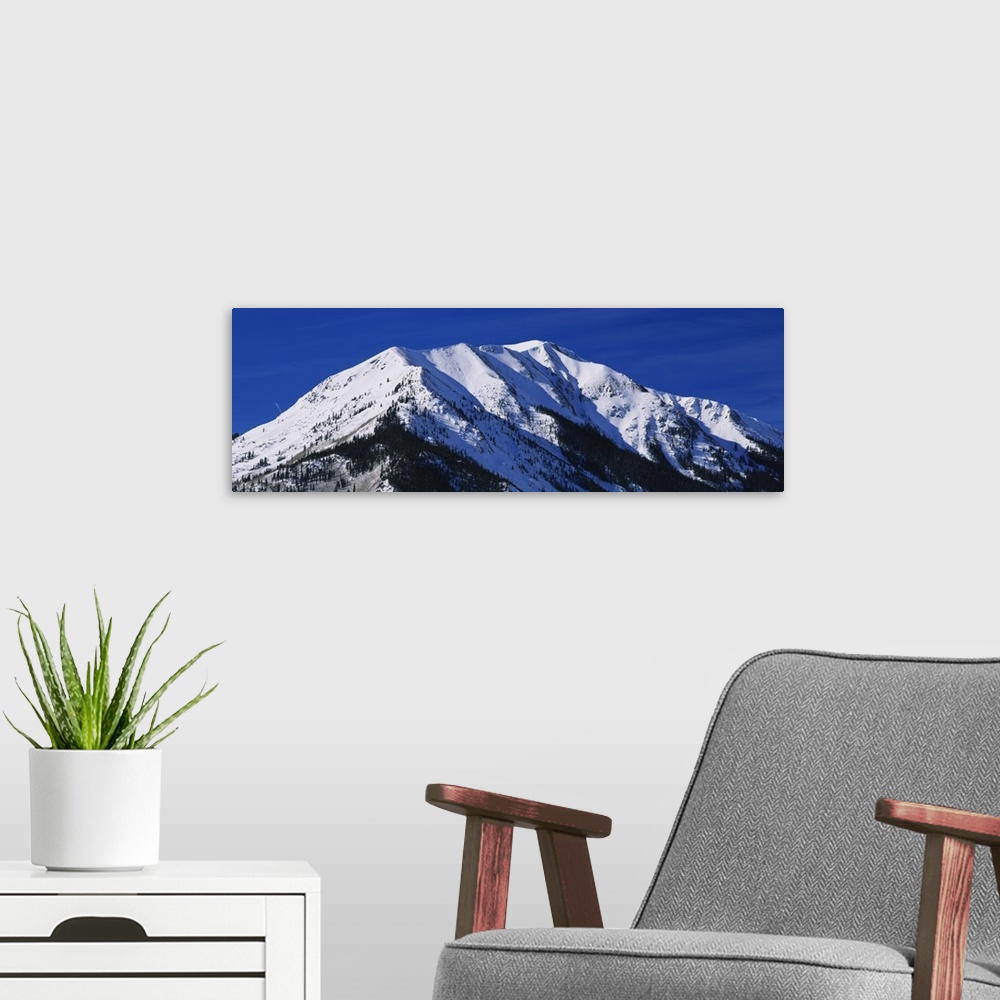 A modern room featuring Low angle view of a snow covered mountain, Rocky Mountains, Twin Lakes, Colorado