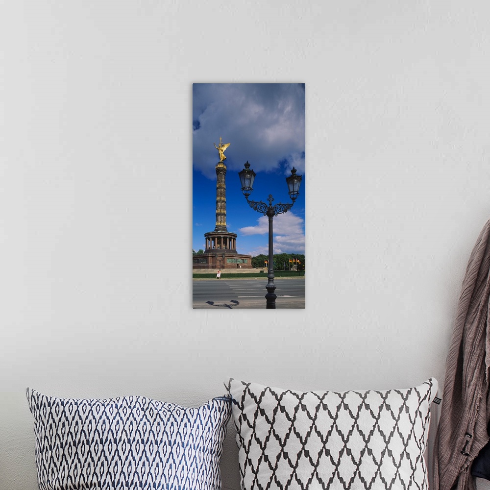 A bohemian room featuring Low angle view of a statue on a tower, Victory Column, Berlin, Germany