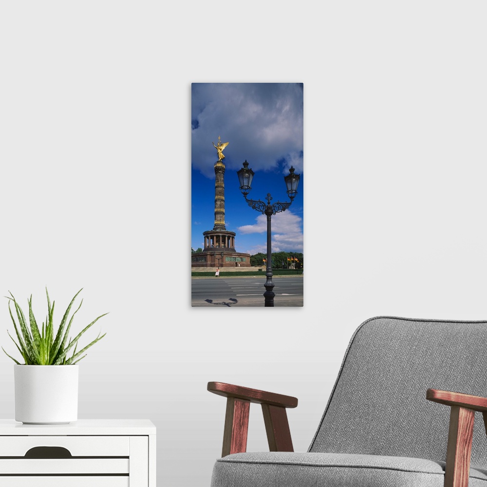 A modern room featuring Low angle view of a statue on a tower, Victory Column, Berlin, Germany