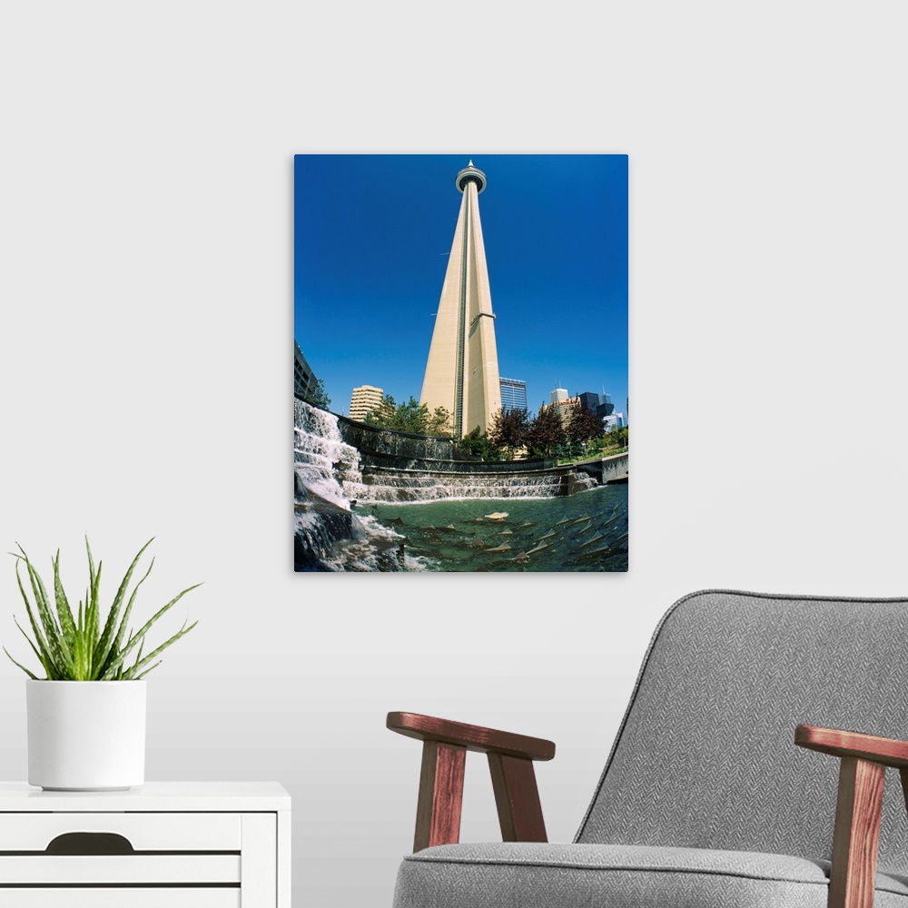 A modern room featuring Low angle view of a tower, CN Tower, Salmon Fountain, Toronto, Ontario, Canada