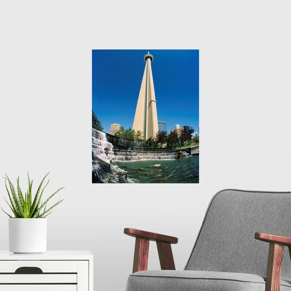 A modern room featuring Low angle view of a tower, CN Tower, Salmon Fountain, Toronto, Ontario, Canada