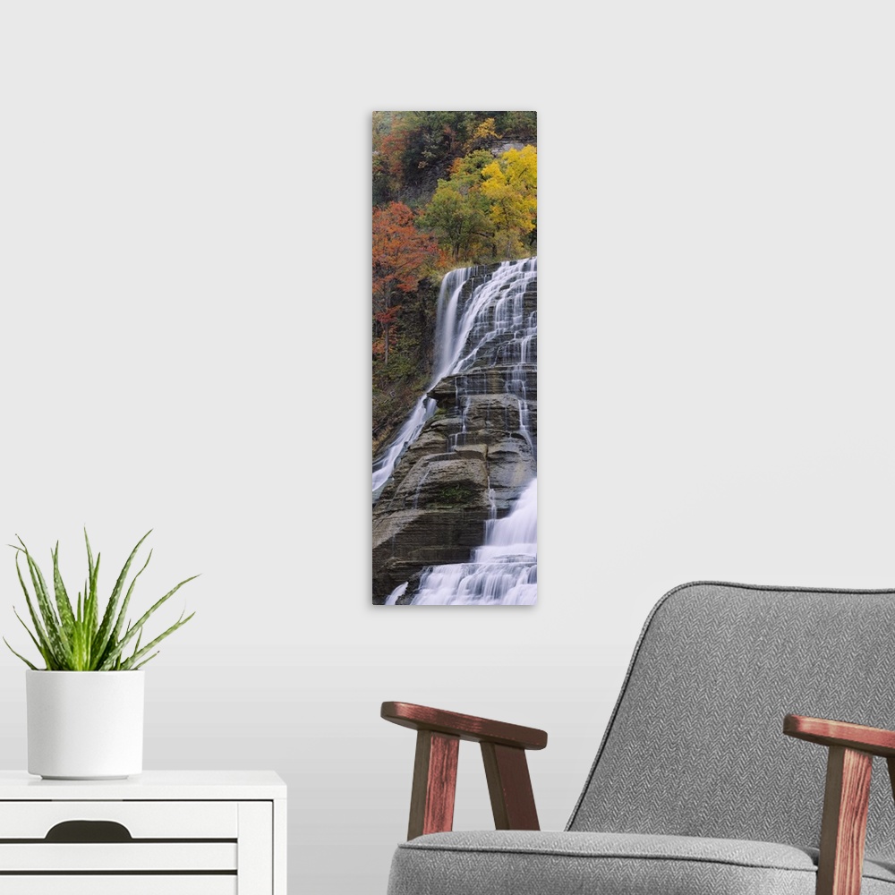 A modern room featuring Portrait, low angle photograph on a large canvas of Ithaca Falls in Ithaca, New York.  Brightly c...