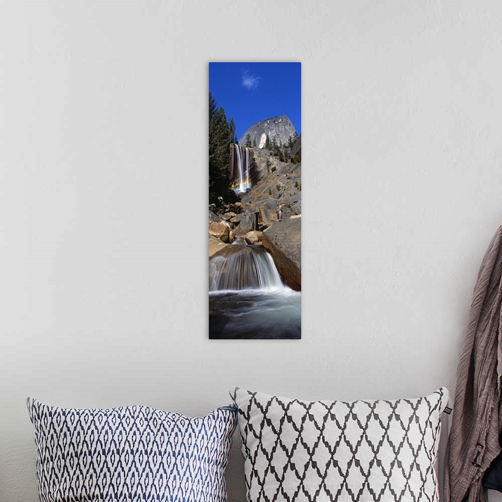 A bohemian room featuring This picture is taken from below and looking up toward the top of a waterfall that flows over lar...