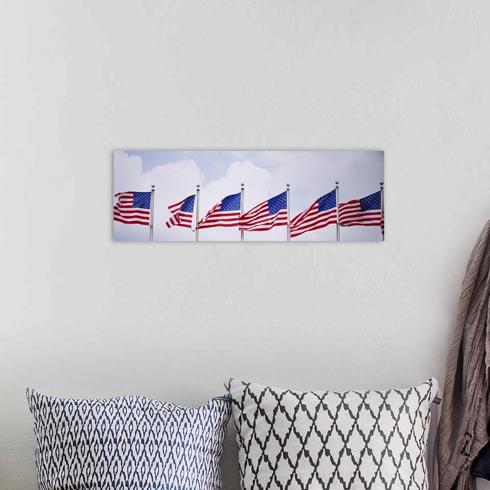A bohemian room featuring Low angle view of American flags fluttering in wind