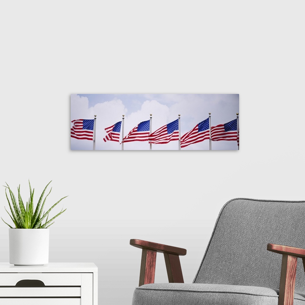 A modern room featuring Low angle view of American flags fluttering in wind