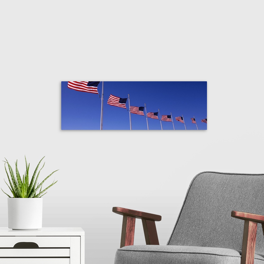 A modern room featuring Low angle view of American flags, Washington Monument, Washington DC, USA