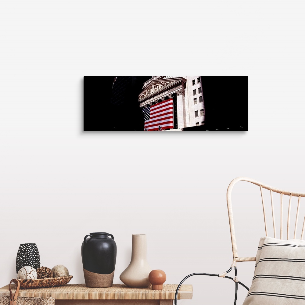 A farmhouse room featuring Low angle view of an American flag on a financial building, New York Stock Exchange, Wall Street,...