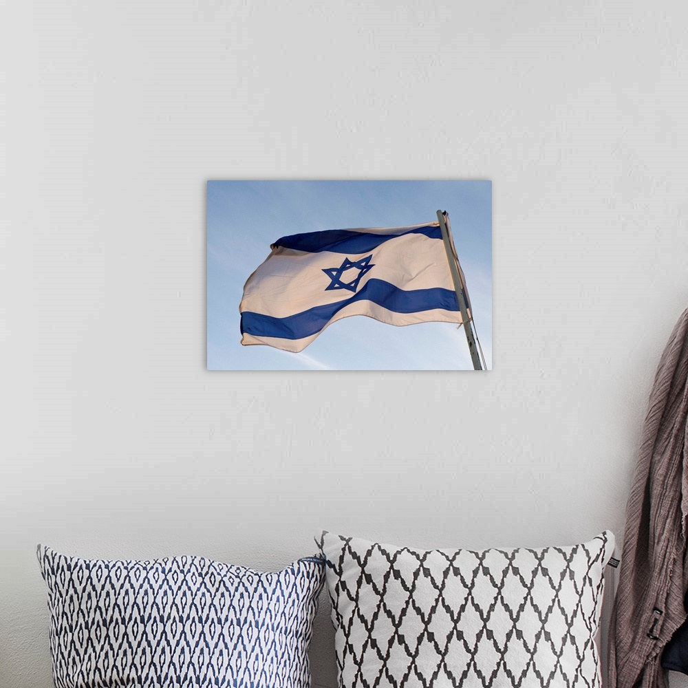 A bohemian room featuring Low angle view of an Israeli Flag fluttering, Israel