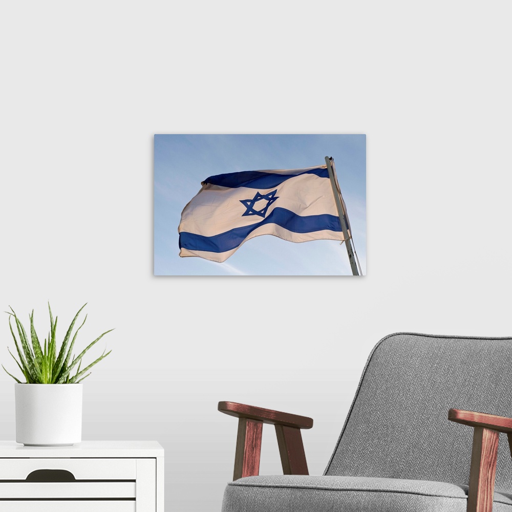 A modern room featuring Low angle view of an Israeli Flag fluttering, Israel