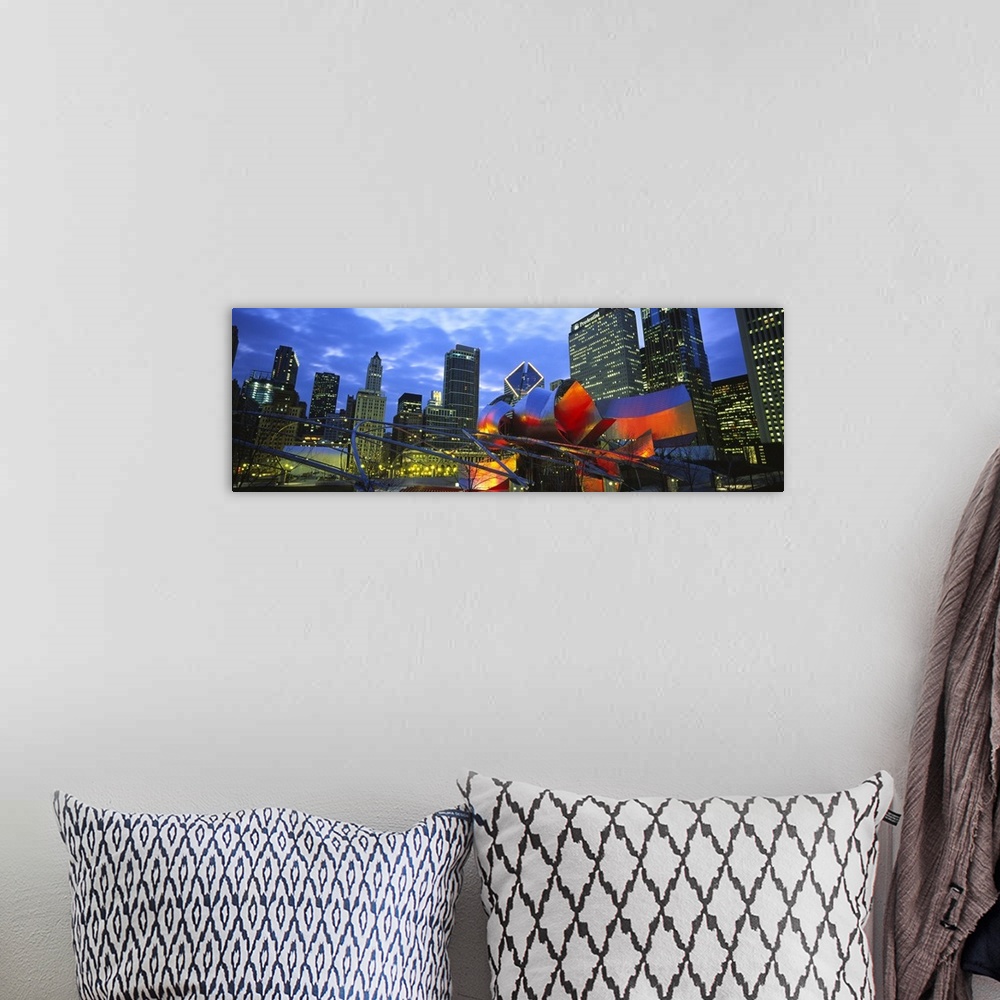 A bohemian room featuring A panoramic shaped wall hanging shows the interior of a city park looking up at the skylineos sky...