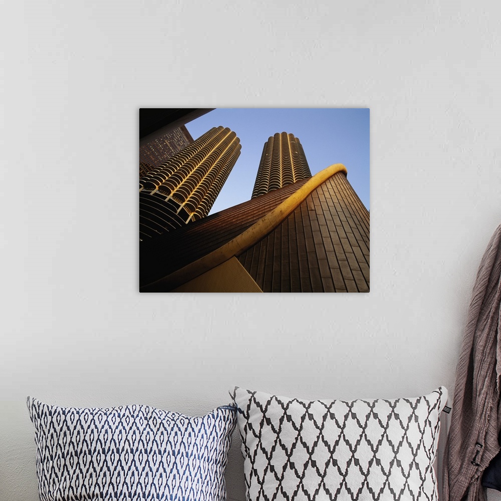 A bohemian room featuring Large photo on canvas of tall buildings seen from below looking up.