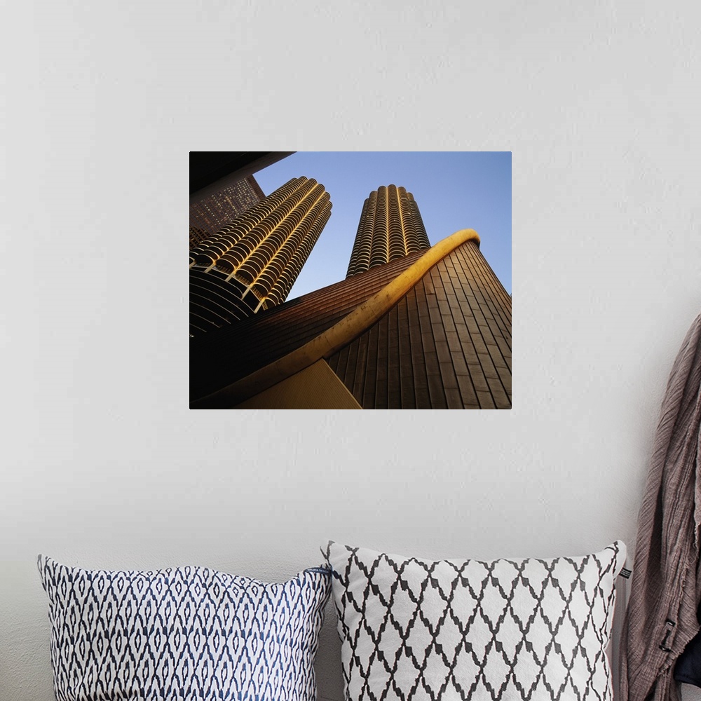 A bohemian room featuring Large photo on canvas of tall buildings seen from below looking up.