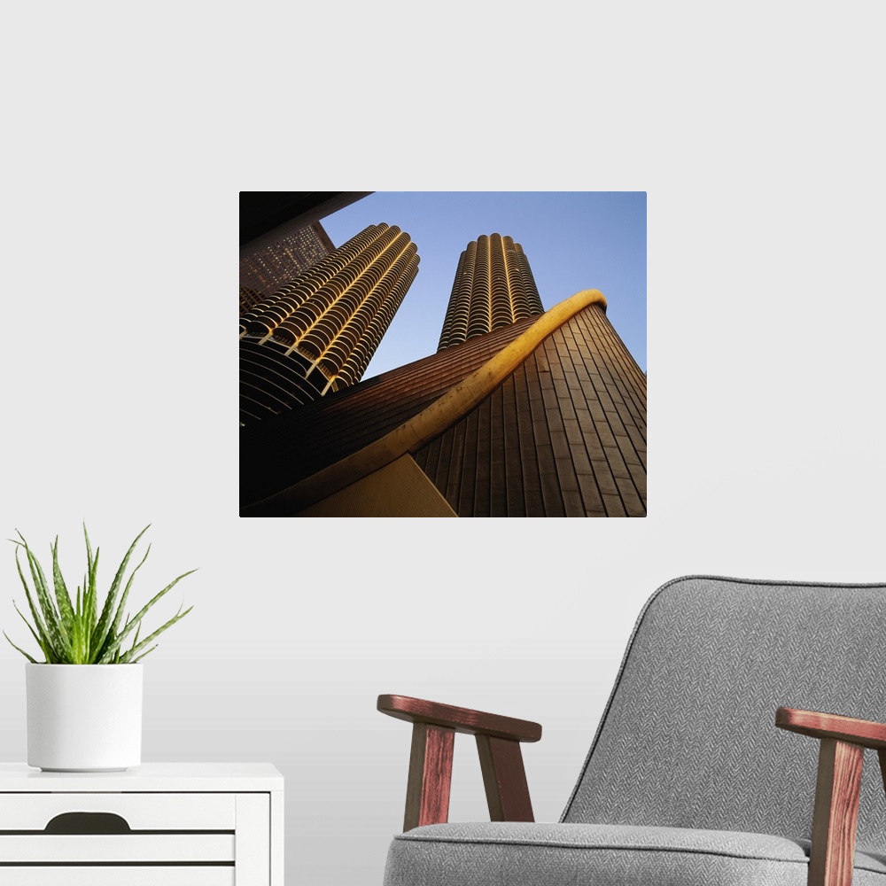 A modern room featuring Large photo on canvas of tall buildings seen from below looking up.