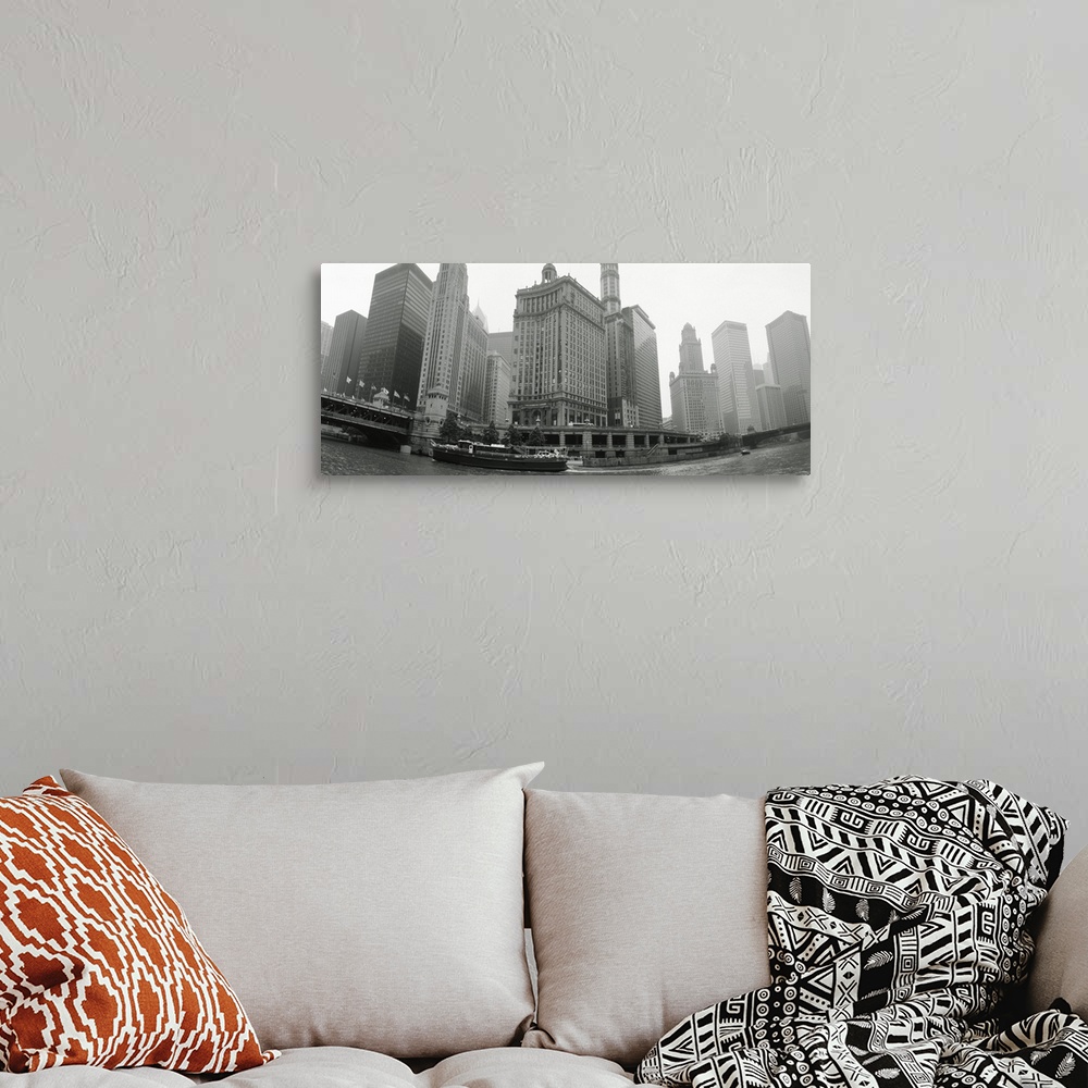 A bohemian room featuring Large, horizontal photograph of boats and skyscrapers, taken at a low angle from the waterfront o...