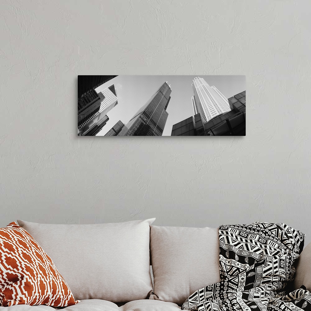 A bohemian room featuring View from the bottom looking up at big buildings in Chicago on canvas.