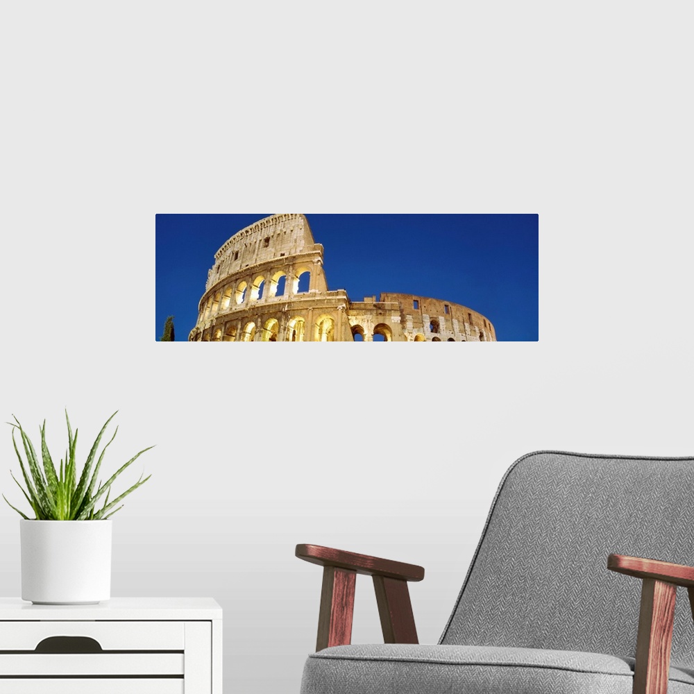 A modern room featuring Low angle view of ruins of an amphitheater, Coliseum, Rome, Lazio, Italy