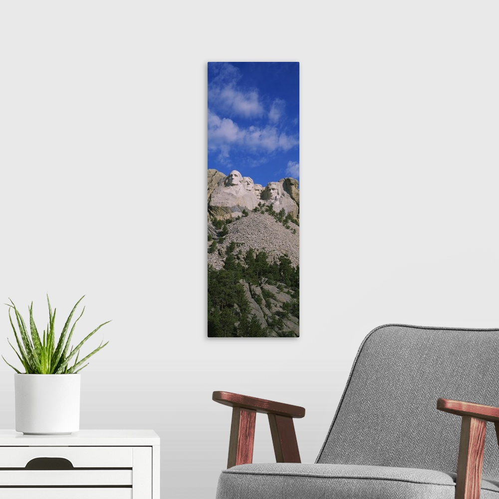 A modern room featuring Low angle view of sculptures of US presidents carved on the rocks of a mountain, Mt Rushmore Nati...