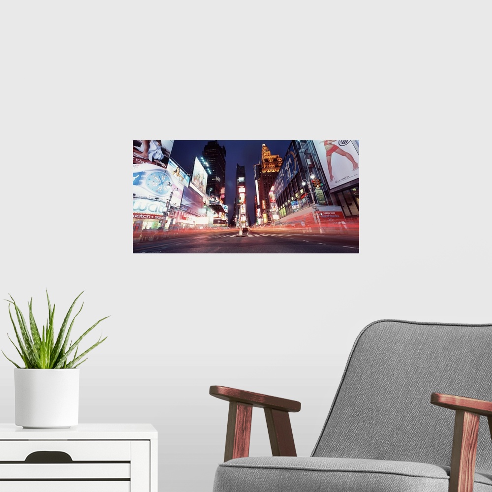 A modern room featuring Low-angle panorama of the lights of Times Square in downtown New York City.
