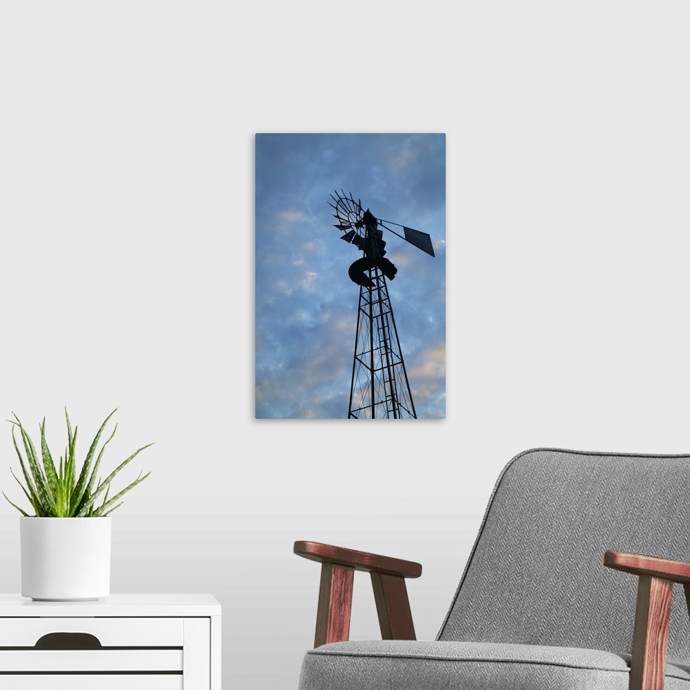 A modern room featuring Low angle view of silhouetted windmill, cloudy sky, Iowa
