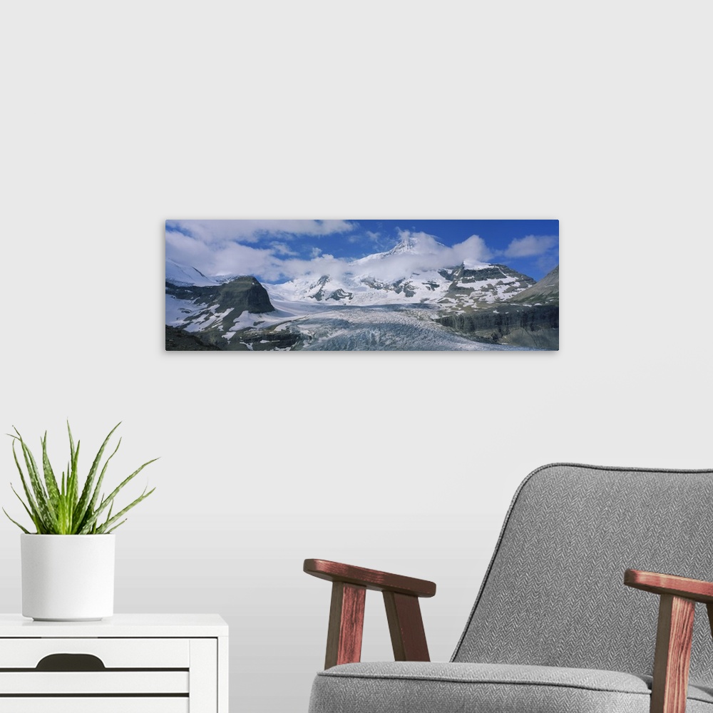 A modern room featuring Low angle view of snowcapped mountains, Mt Robson, Mount Robson Provincial Park, British Columbia...