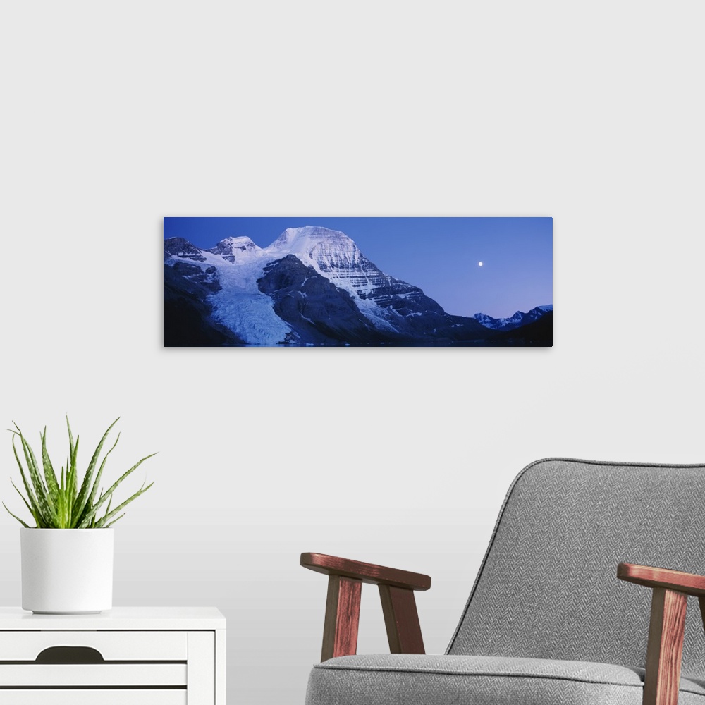 A modern room featuring Low angle view of snowcapped mountains, Mt Robson, Mount Robson Provincial Park, British Columbia...