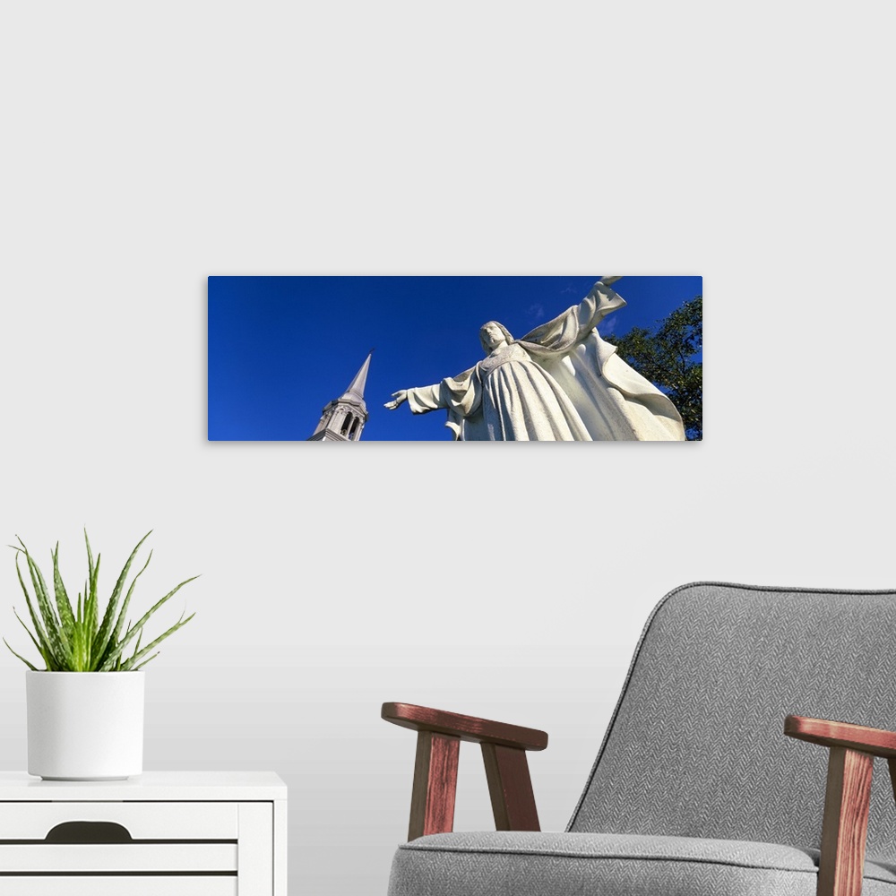 A modern room featuring Low angle view of the statue of Jesus Christ, Grandes-Bergeronnes, Quebec, Canada