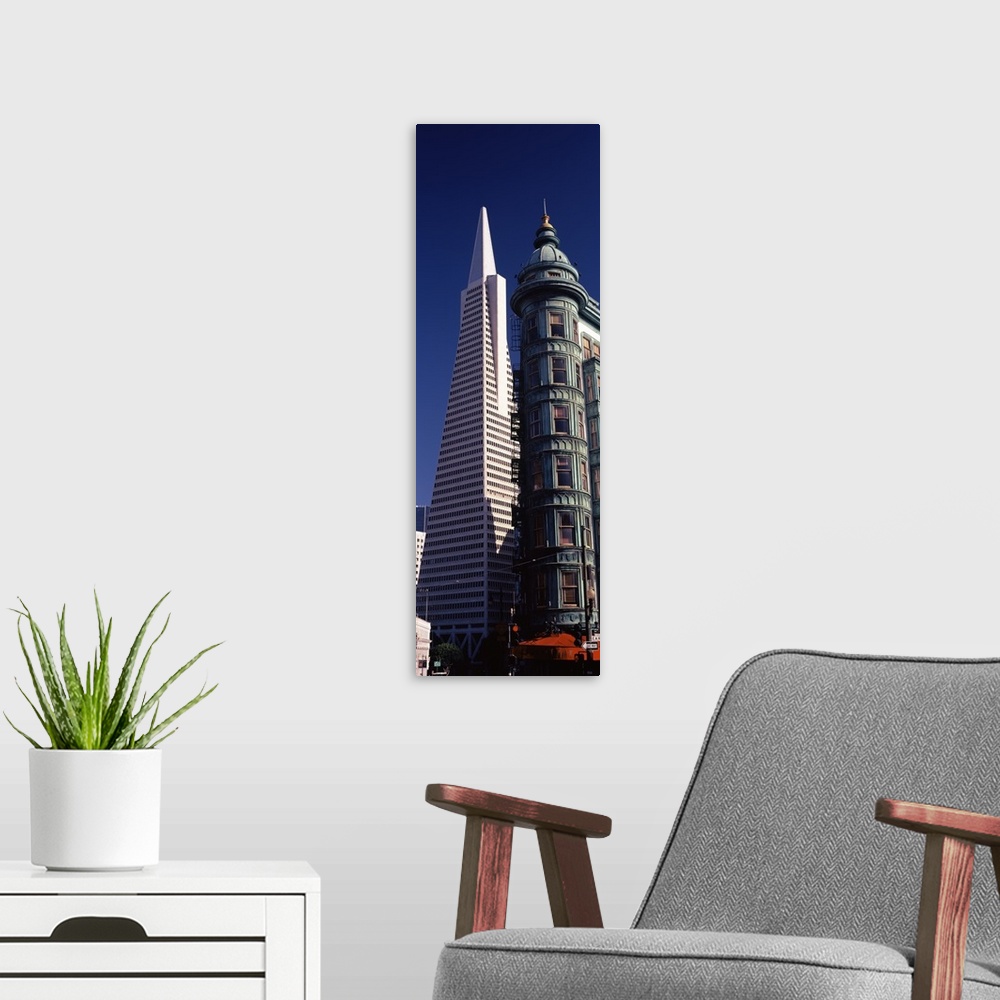 A modern room featuring Low angle view of towers, Columbus Tower, Transamerica Pyramid, San Francisco, California,