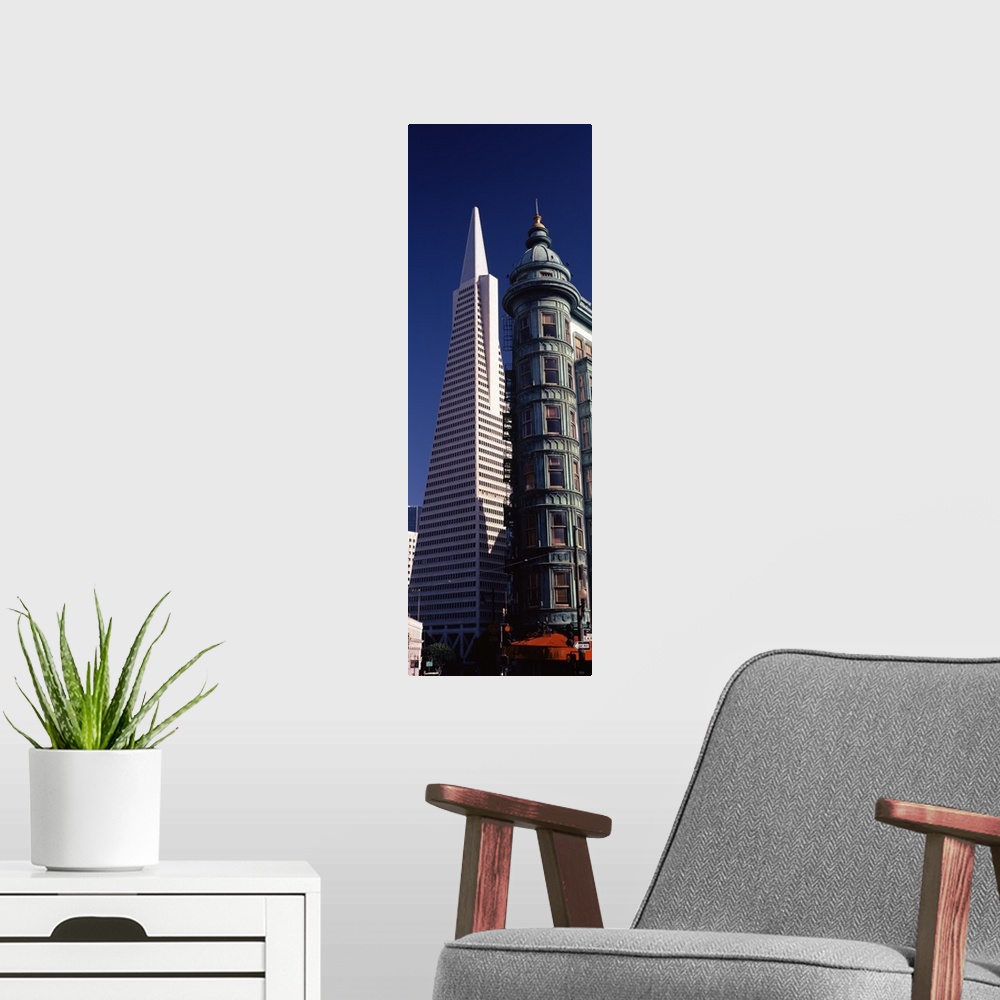 A modern room featuring Low angle view of towers, Columbus Tower, Transamerica Pyramid, San Francisco, California,