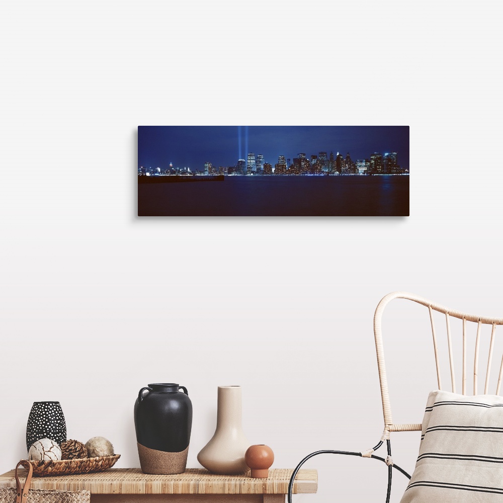 A farmhouse room featuring Panoramic photograph of lit up skyline and waterfront at night.