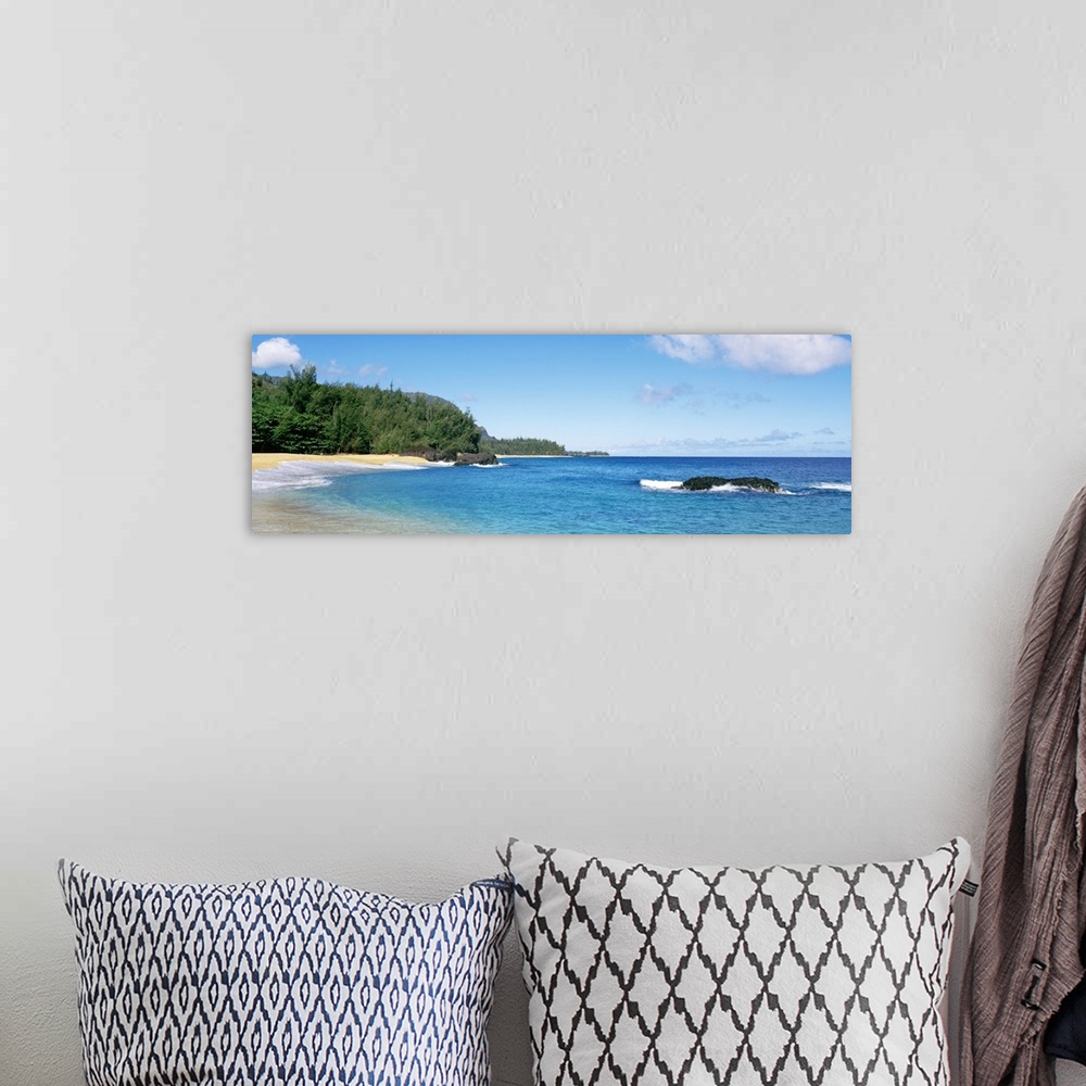 A bohemian room featuring Large panoramic photo of Lumahai Beach in Kauai, Hawaii during the summer.
