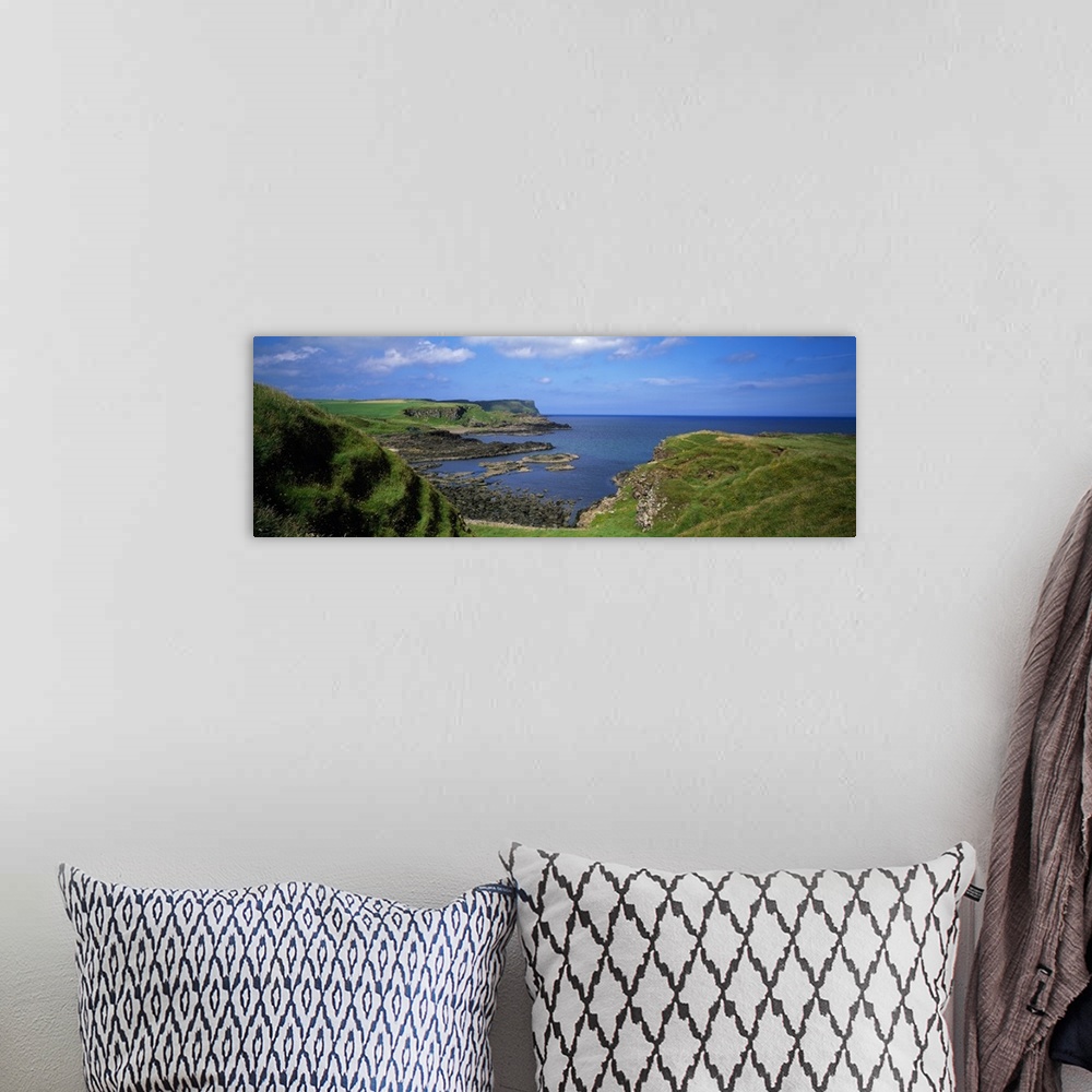 A bohemian room featuring Lush green coastal cliffs, blue sea, Northern Ireland