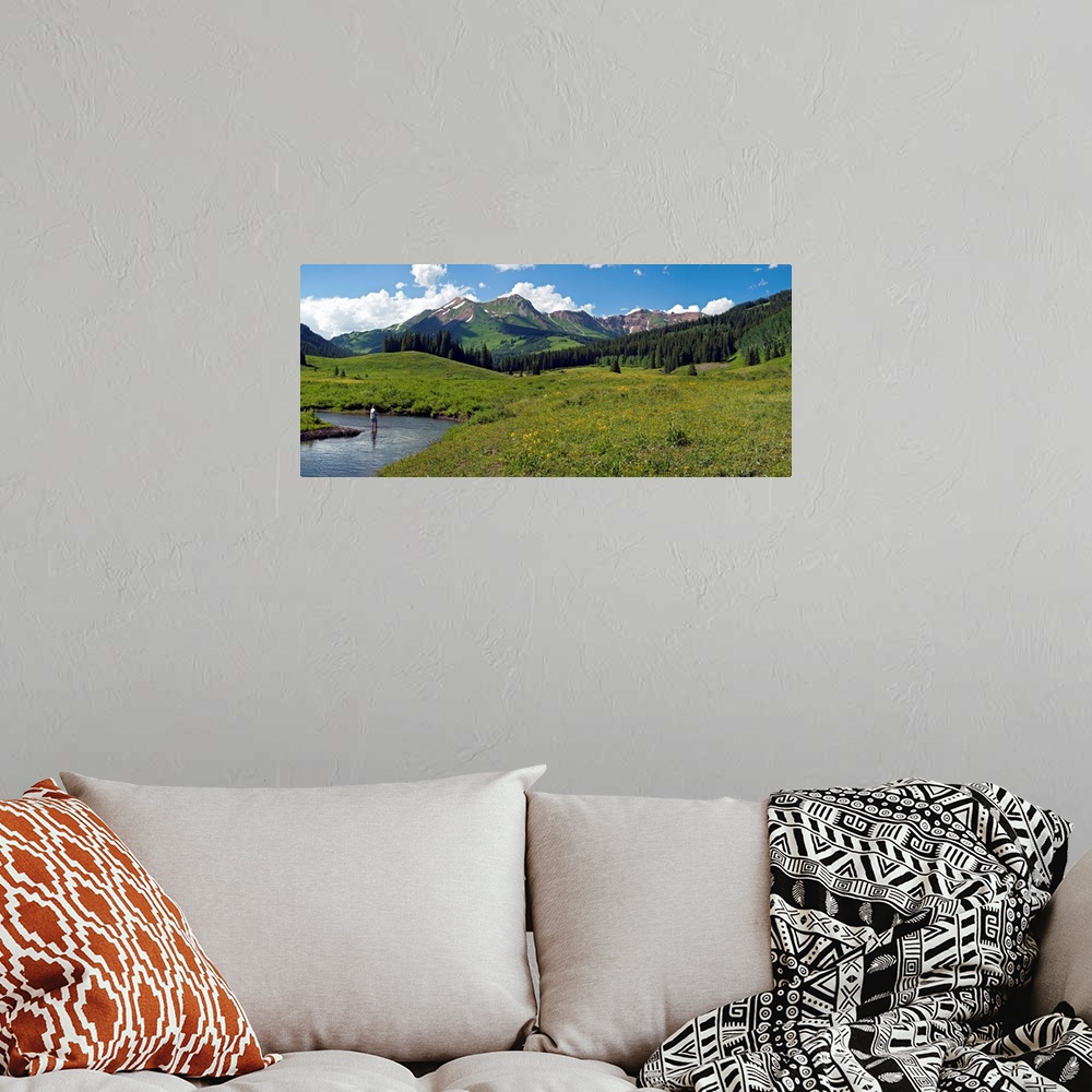 A bohemian room featuring Man fly-fishing in Slate River, Crested Butte, Gunnison County, Colorado