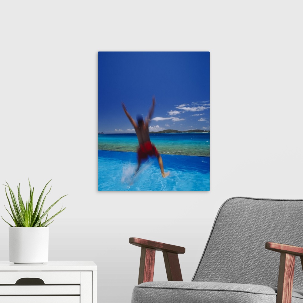 A modern room featuring Man Jumping Into Pool