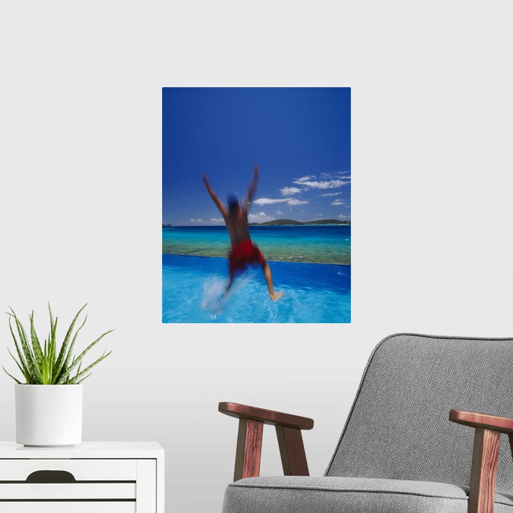 A modern room featuring Man Jumping Into Pool