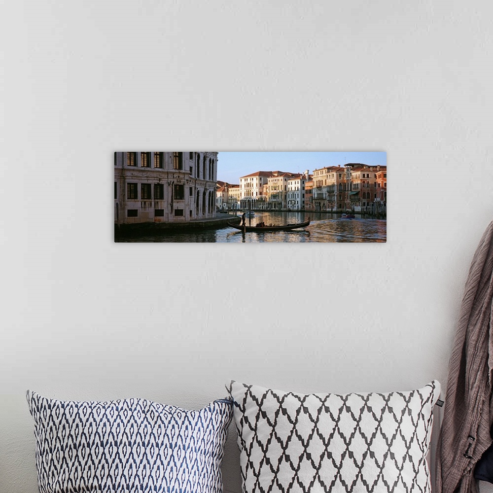 A bohemian room featuring Man on a gondola in a canal, Grand Canal, Venice, Italy