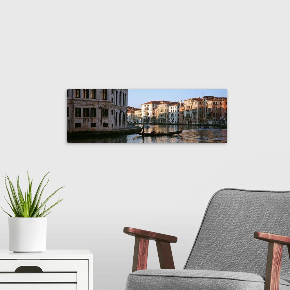 A modern room featuring Man on a gondola in a canal, Grand Canal, Venice, Italy