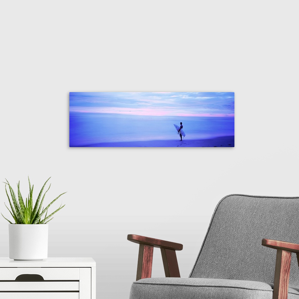 A modern room featuring Man With Surfboard on Beach Costa Rica