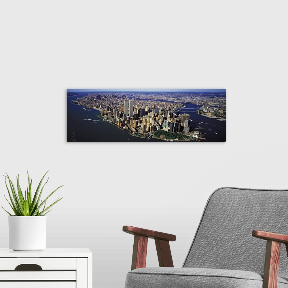 A modern room featuring Panoramic, aerial photograph of New York City, including the World Trade Center.