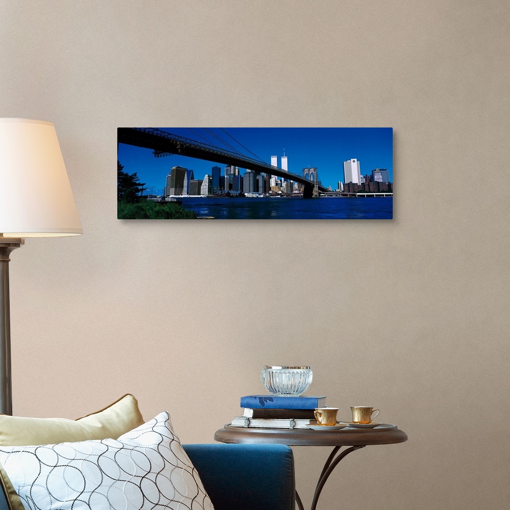 A traditional room featuring Panoramic photo print of the Brooklyn Bridge that leads towards the skyline of downtown New York ...