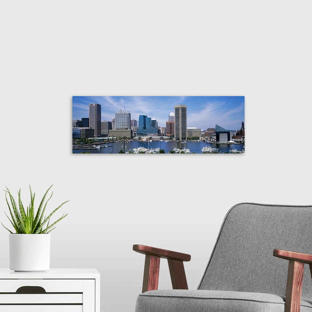 A modern room featuring Panoramic photograph showcases the skyline of a large city within the Northeastern United States ...