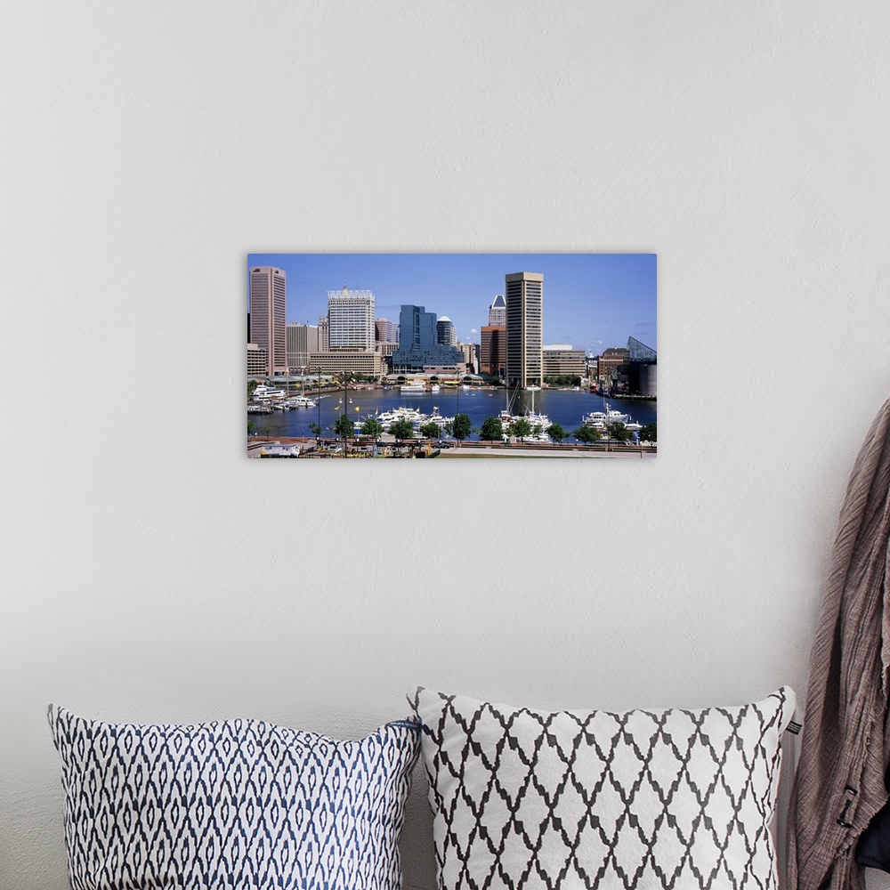 A bohemian room featuring Image of the inner Baltimore harbor skyline with boats parked in the marina waters.