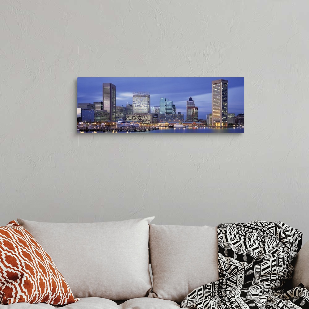 A bohemian room featuring This large panoramic photograph is of the Baltimore skyline at dusk with cool colors and the buli...